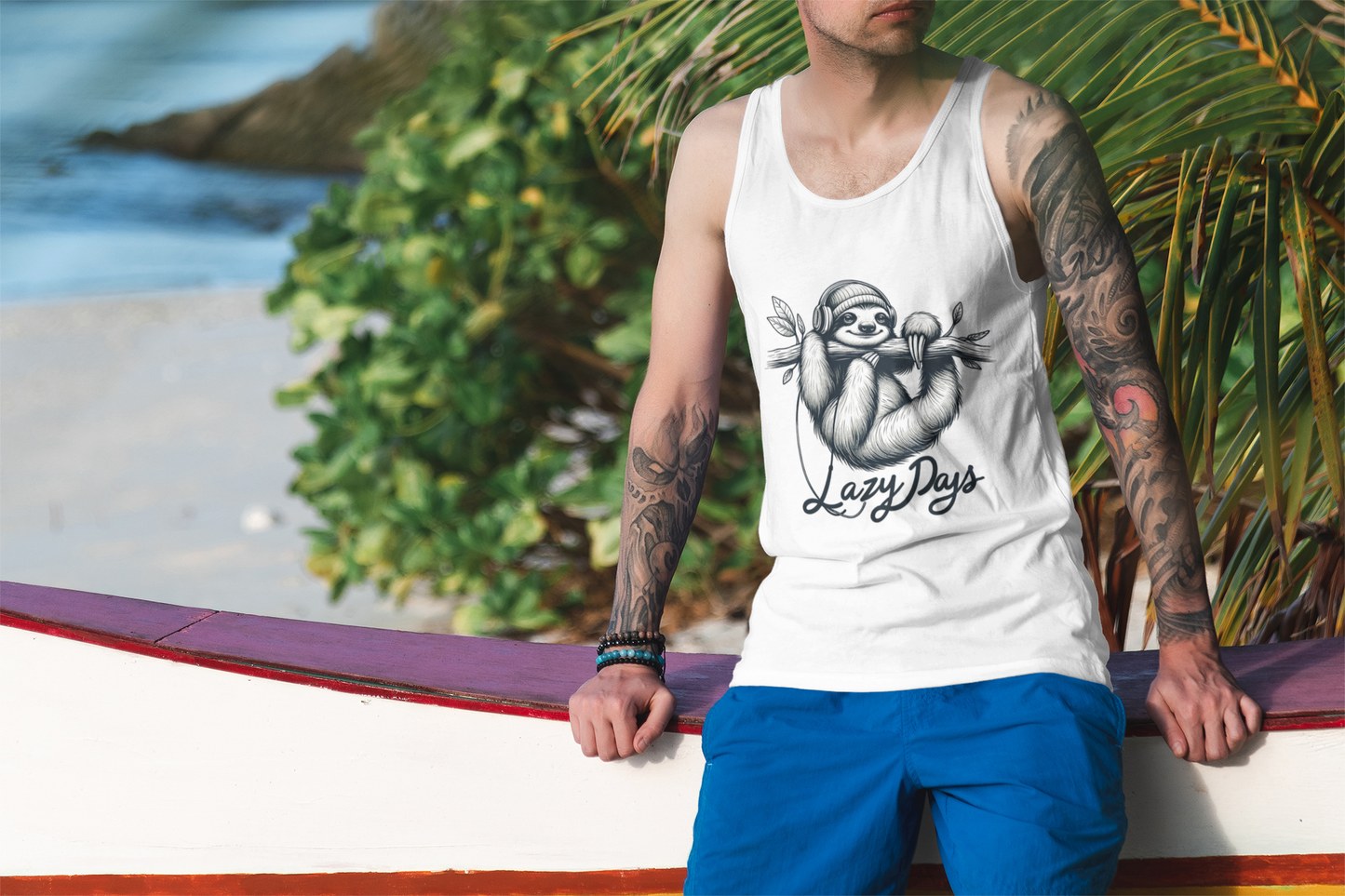 on the beach surfer sun Cotton tank top featuring a sloth hanging from a branch with headphones and the text 'Lazy Days', perfect for a relaxed and playful look.