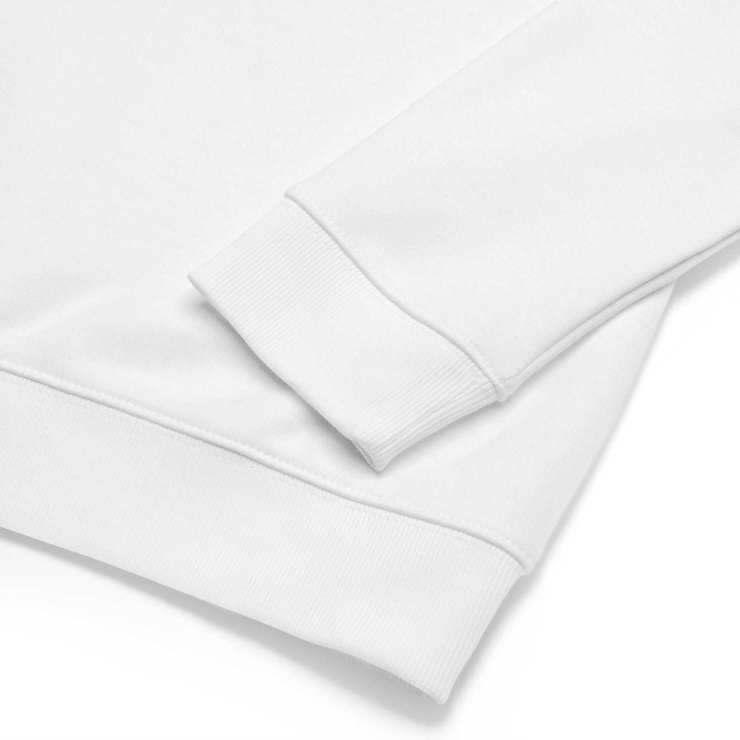 Close up of a white organic long sleeved shirt showing the details of the cuff