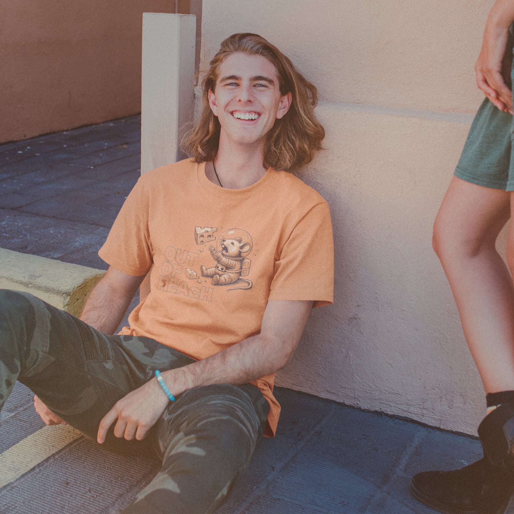 Terracotta colour‑wash tee with space mouse illustration