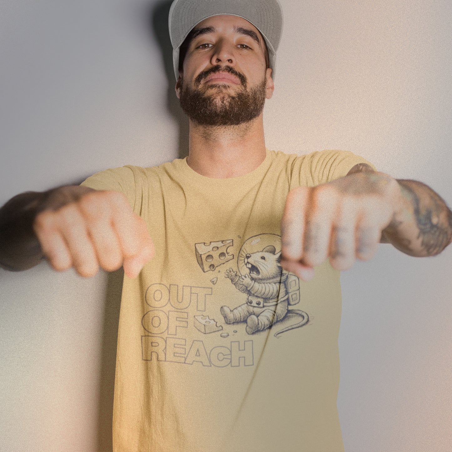 Man wearing butter-coloured Space Mouse graphic tee