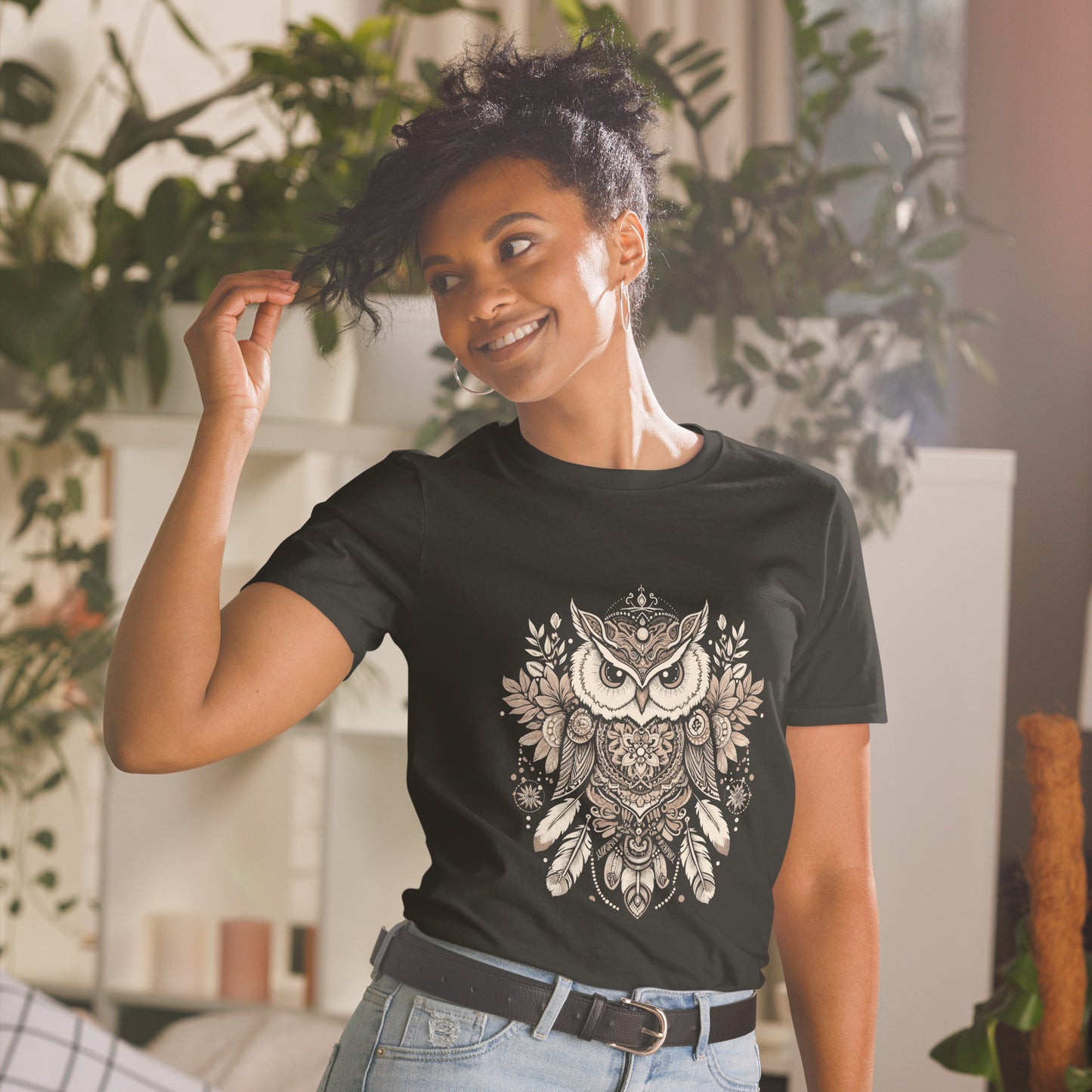 Young Woman wearing a balck t shirt featuring a large bohemian print of an owl