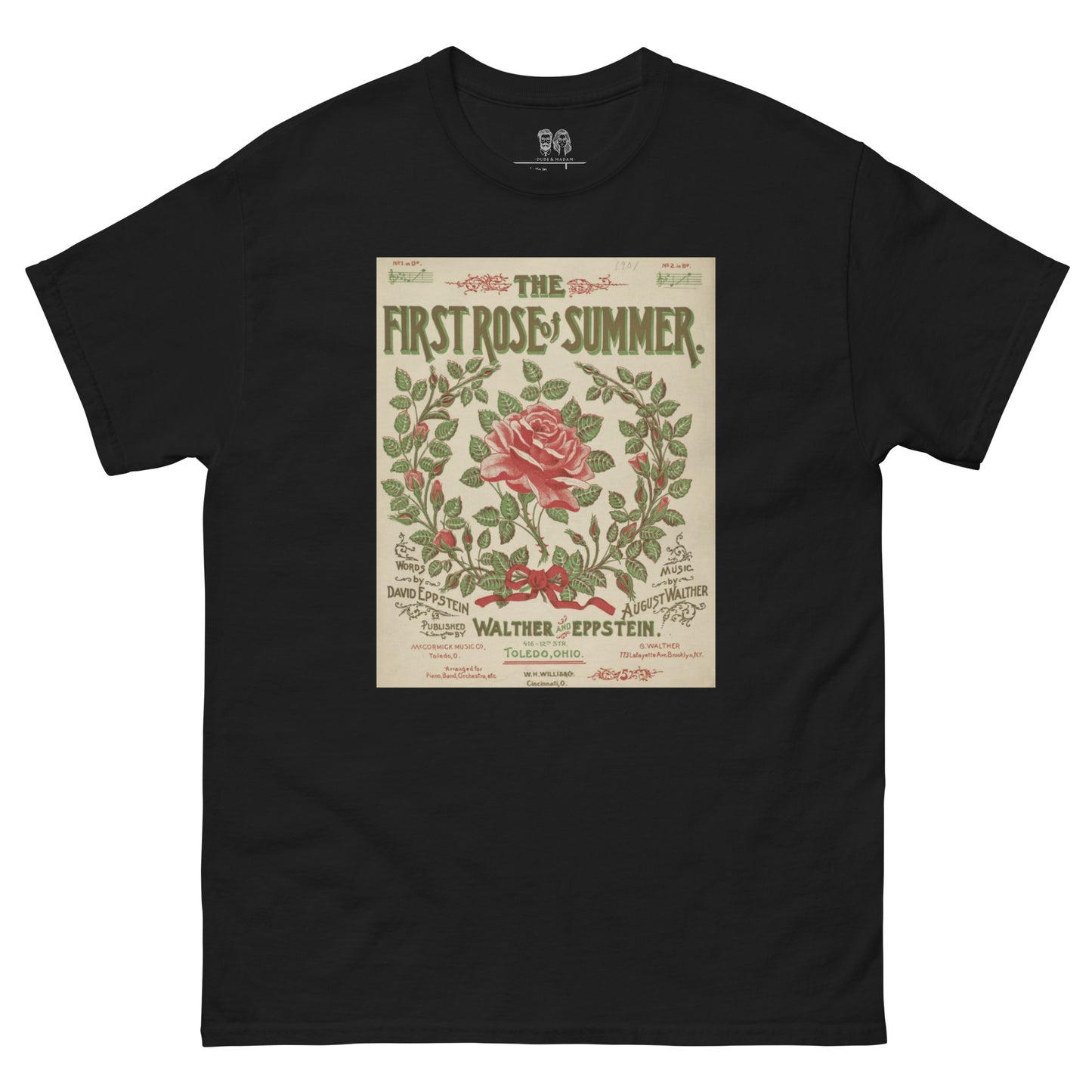 Black tee with large print of a wreath of leaves and roses