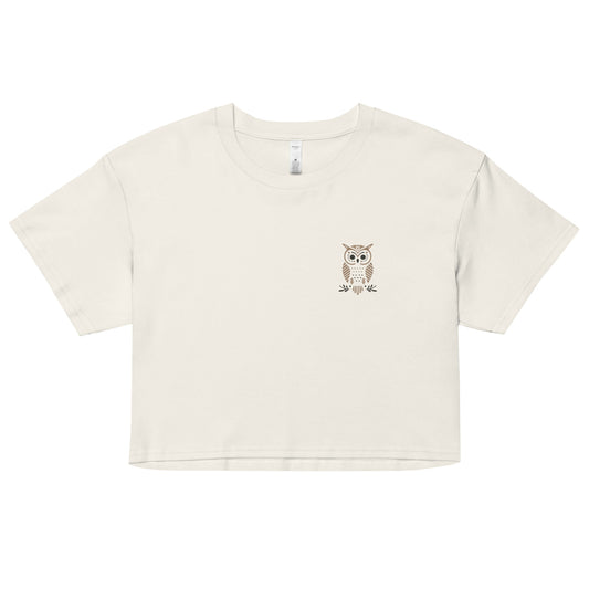 Off white crop top with crew neckline and a small owl pocket print design