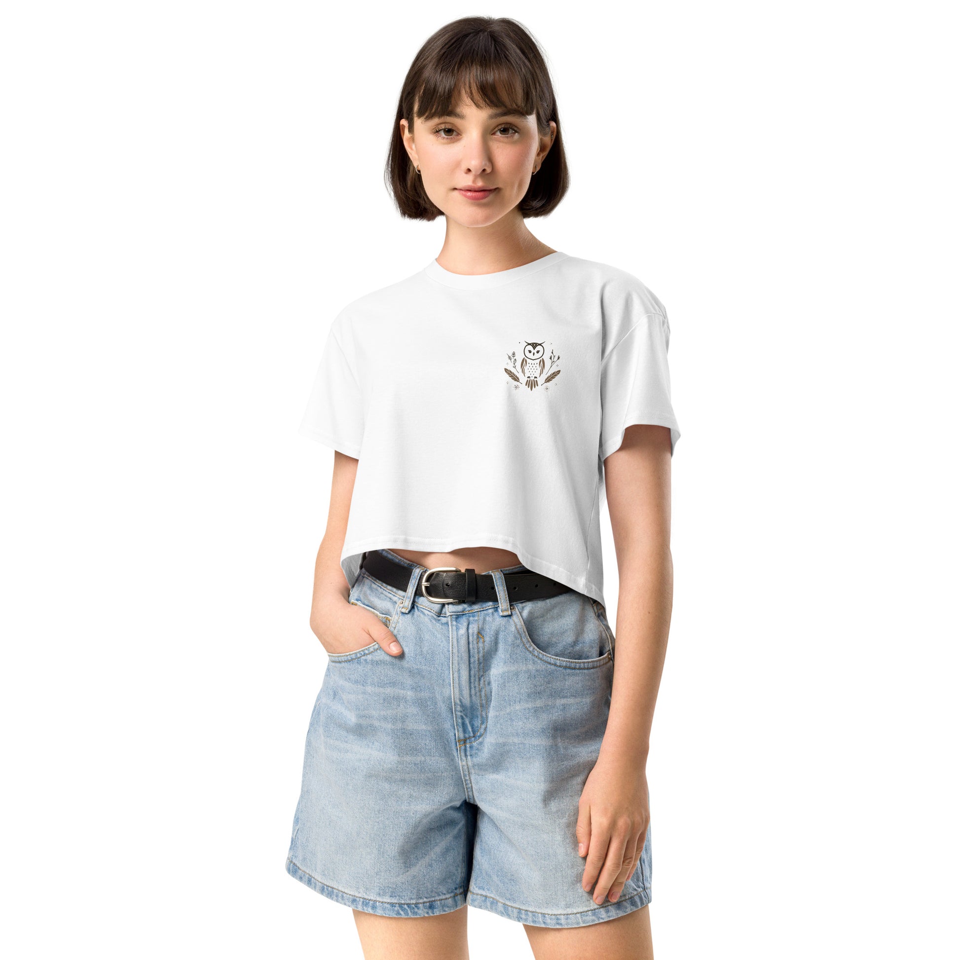 Woman wearing Jeans shorts and a white crop top with a cute owl design 